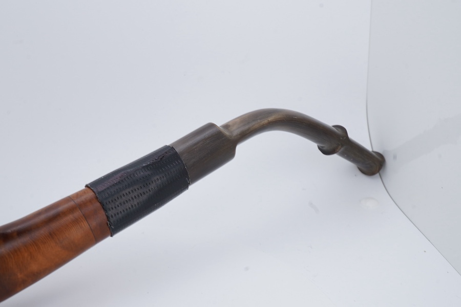 An American Civil War briar pipe in the form of the head of a bearded soldier, with horn mouthpiece, 23cm long